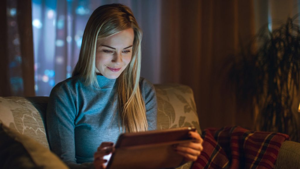 Woman watching home movies on a tablet